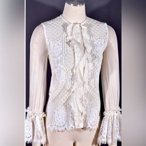 ALEXIS
Lace Pattern Crew Neck Blouse
Size: XS